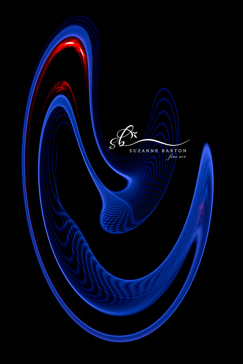 A light trail of blues dotted with red create an abstract image of How Doth the Little Crocodile from the Through the Looking Glass story.