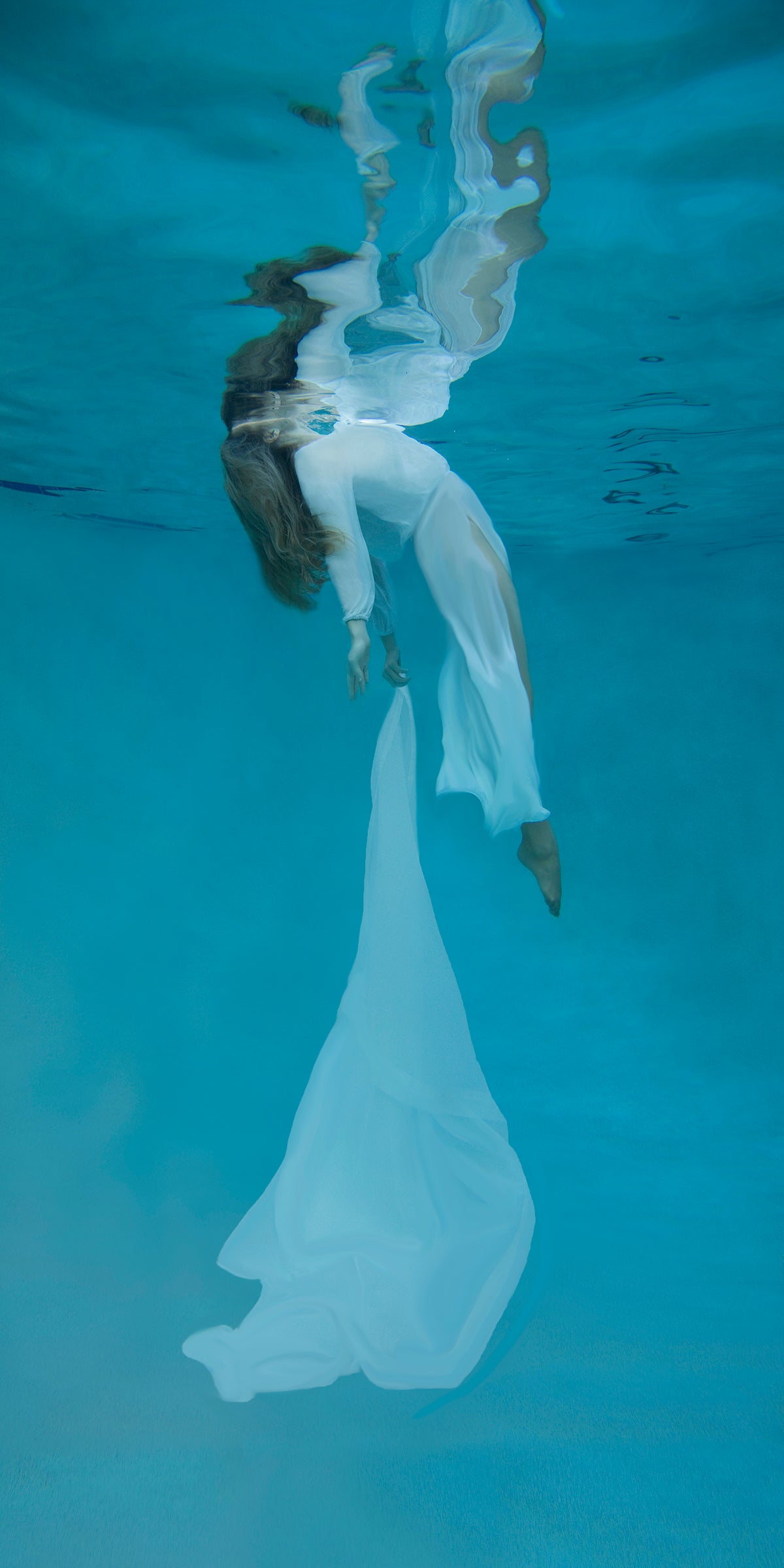  The gentle flow of fabric and weightlessness as the subject floats to the surface will leave you transformed. 