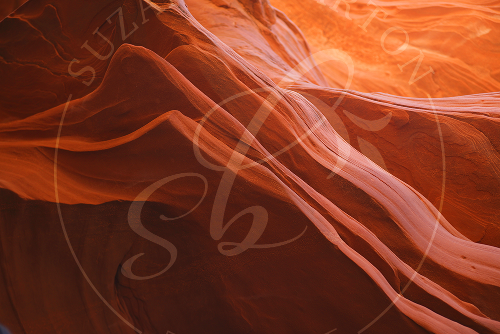 Antelope Canyon and its stunning hues and intricate rock formations in pinks, orange and brown hues. 