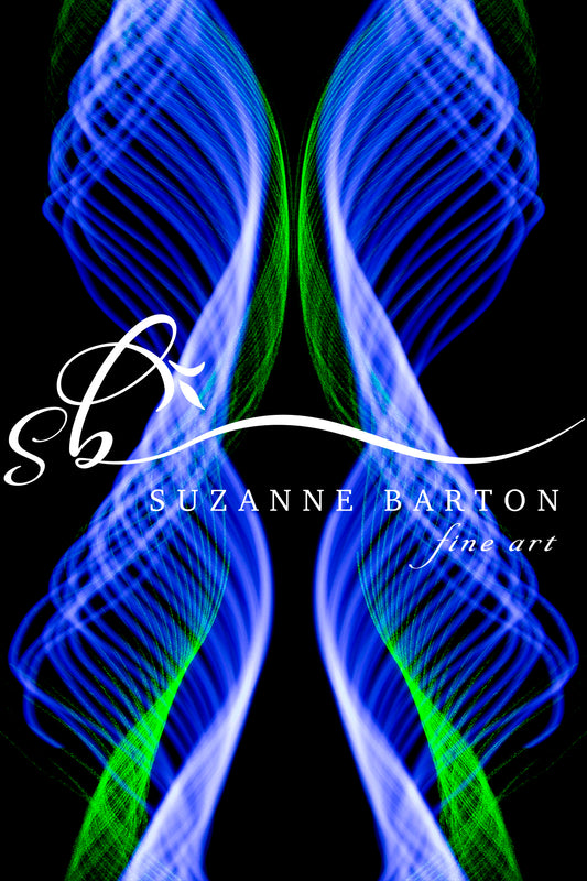 Two bands of light trails symmetrically placed in the middle of the piece. The vibrant light in blue and green colors are energetic and represent movement.