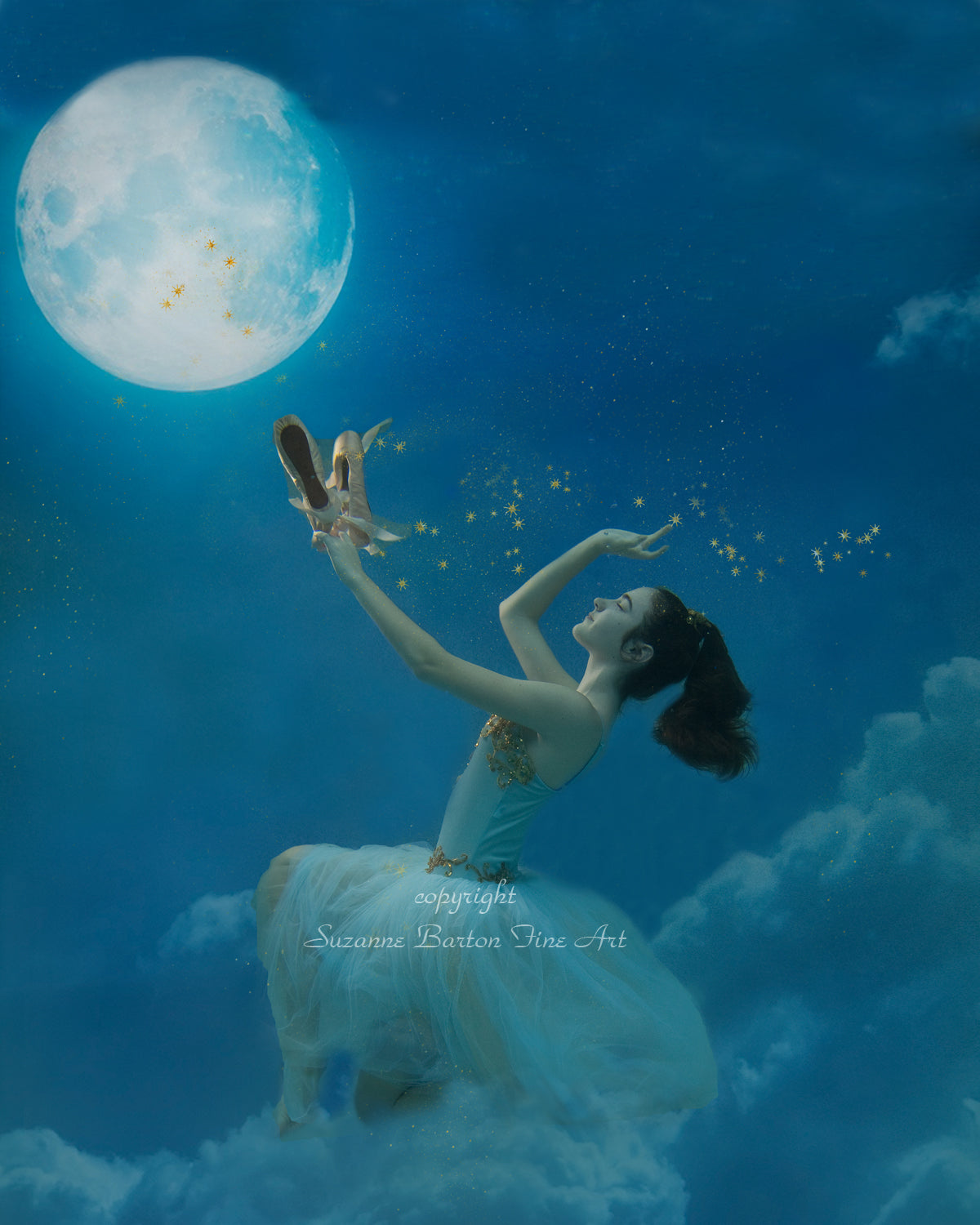 A fantastical underwater fine art photograph of a ballerina lit magically by the moon.